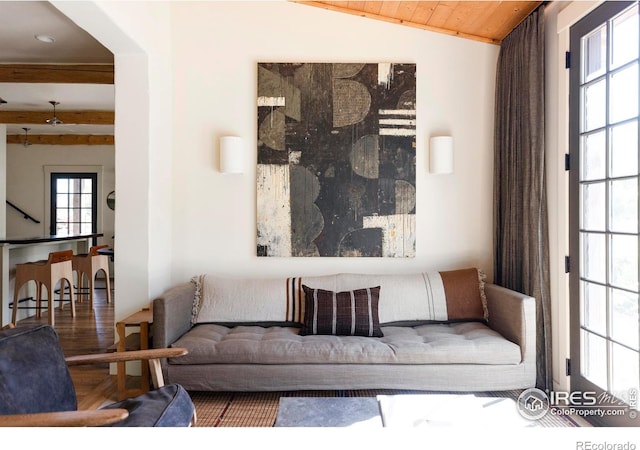 living room with wooden ceiling, wood-type flooring, and lofted ceiling