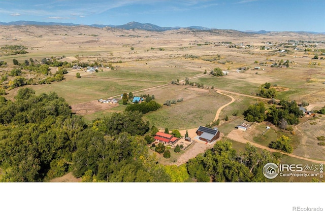 bird's eye view with a mountain view and a rural view