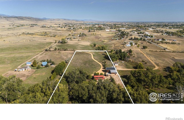 bird's eye view featuring a mountain view and a rural view