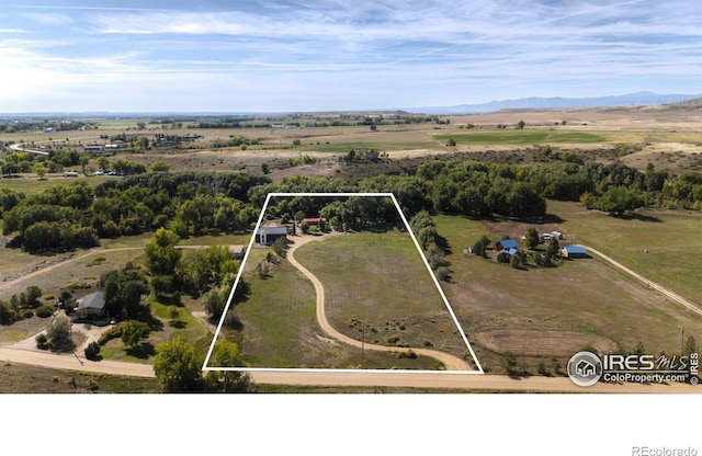 aerial view with a mountain view and a rural view