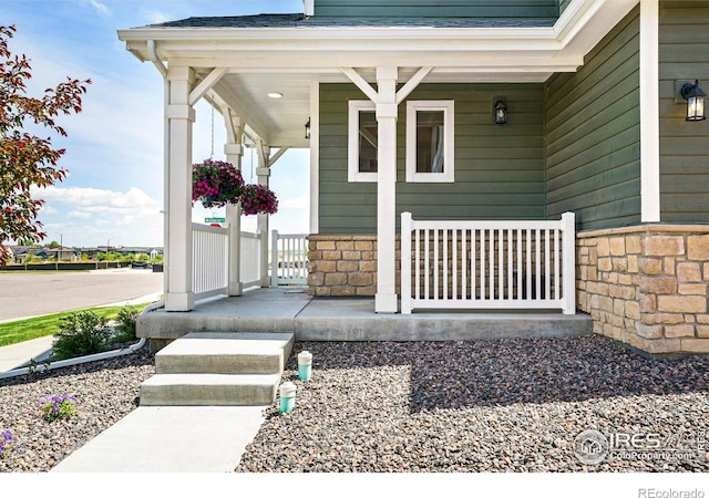 property entrance with covered porch