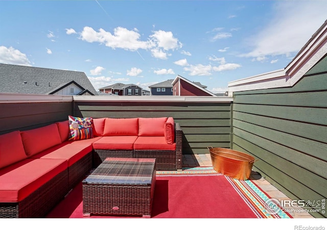 wooden deck with outdoor lounge area