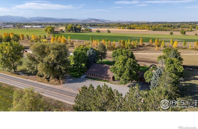 birds eye view of property with a mountain view and a rural view