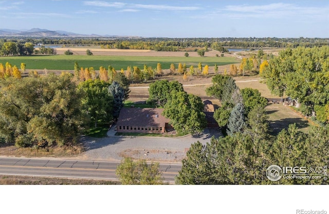 birds eye view of property with a mountain view and a rural view