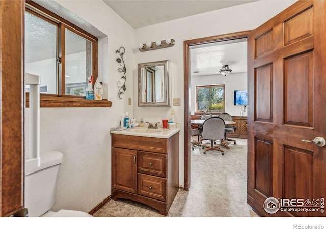 bathroom with vanity and toilet