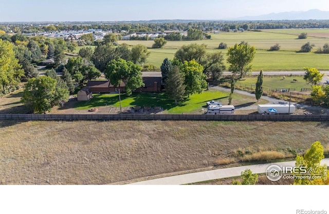 birds eye view of property with a rural view