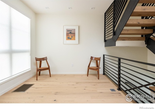 living area featuring light hardwood / wood-style floors