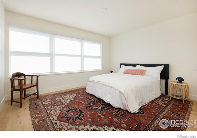 bedroom with light hardwood / wood-style floors