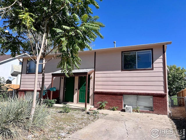 2024 Lincoln St, Longmont, CO 80501 - bi-level home with fence and brick siding