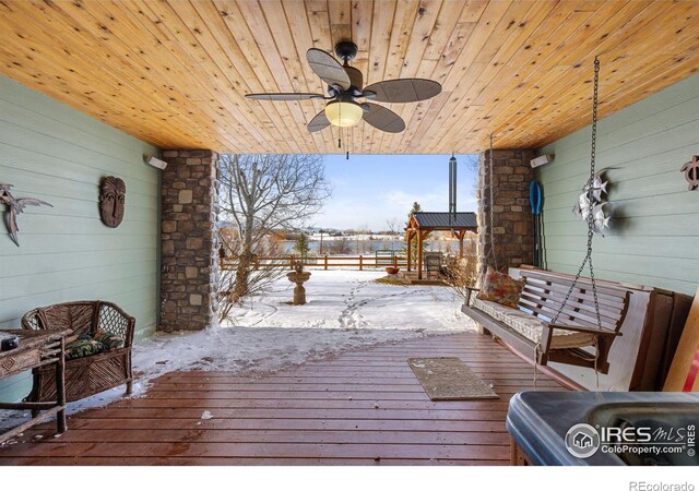 snow covered deck with ceiling fan