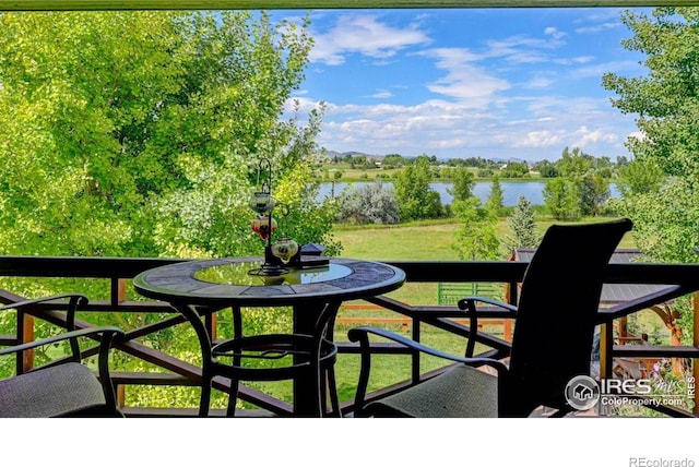 balcony featuring a water view