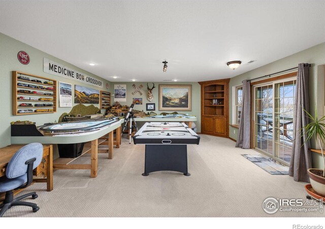 recreation room featuring recessed lighting, visible vents, and light colored carpet