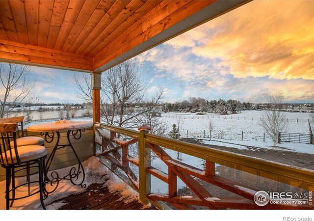 view of snow covered deck