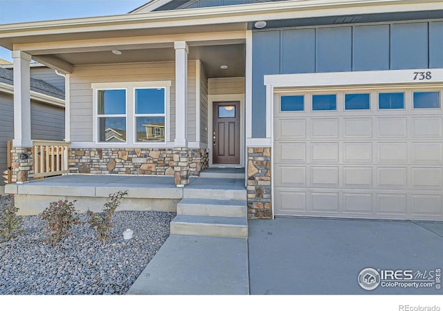 property entrance featuring a porch and a garage