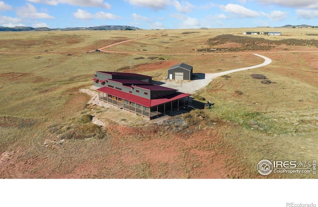 birds eye view of property with a rural view