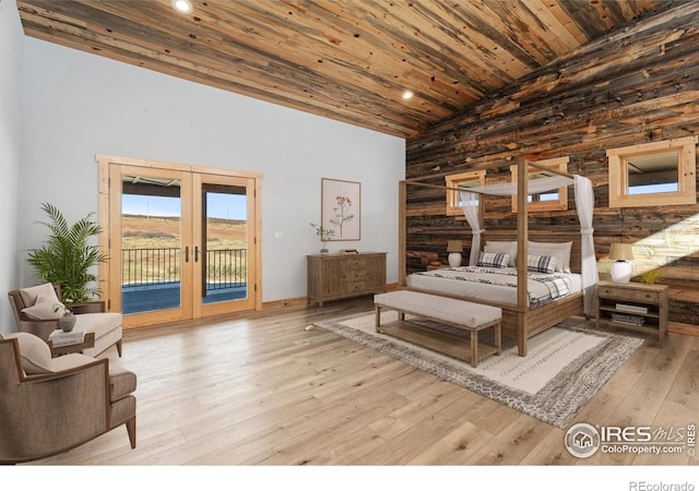 bedroom featuring light wood-type flooring, access to outside, wood ceiling, and french doors