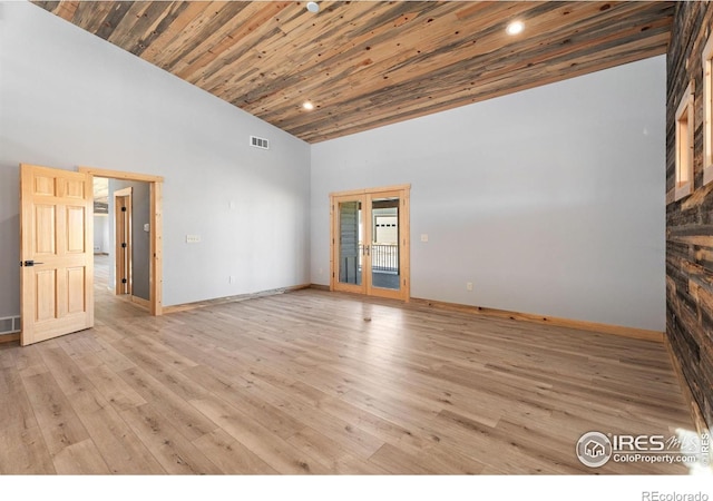 interior space with light hardwood / wood-style flooring, wooden ceiling, and high vaulted ceiling