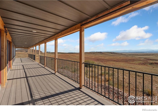 wooden terrace with a rural view