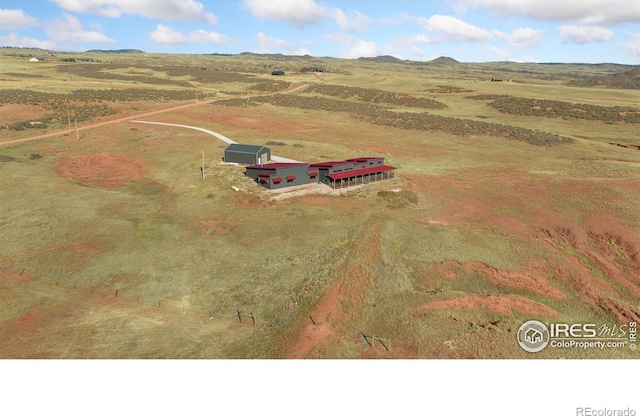 birds eye view of property with a rural view and a mountain view