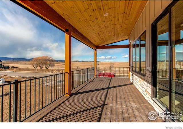 wooden terrace with a rural view