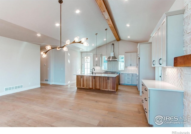 kitchen with white cabinets and a spacious island