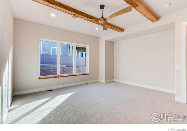 empty room featuring recessed lighting, baseboards, beam ceiling, and carpet floors