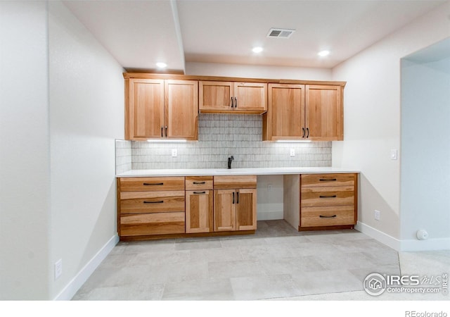 kitchen with sink and backsplash