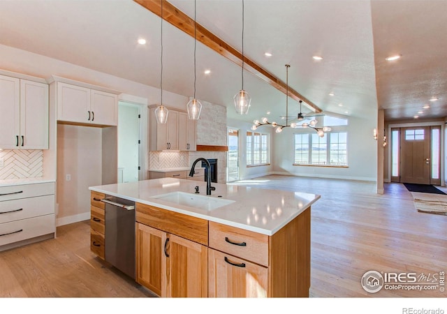 kitchen with vaulted ceiling with beams, dishwasher, decorative backsplash, light wood-style floors, and a sink