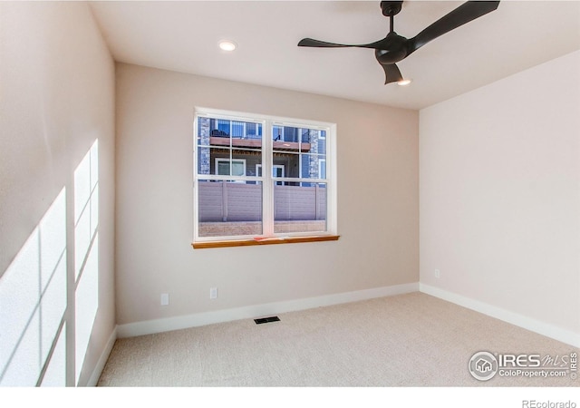 spare room featuring baseboards, visible vents, recessed lighting, ceiling fan, and carpet flooring