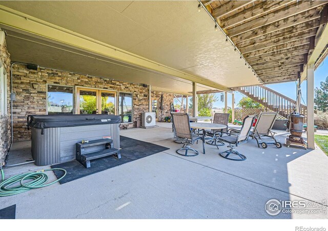 view of patio / terrace featuring a hot tub