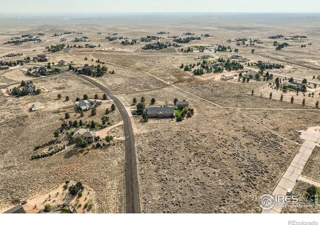 birds eye view of property featuring a rural view