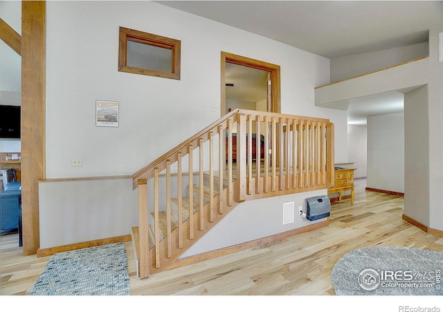 staircase featuring hardwood / wood-style floors