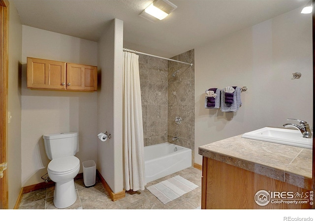 full bathroom with vanity, shower / bath combination with curtain, and toilet