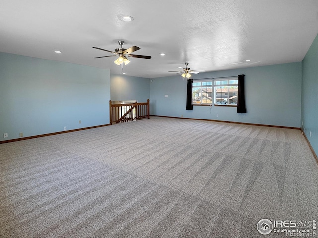 carpeted empty room with recessed lighting, baseboards, and ceiling fan