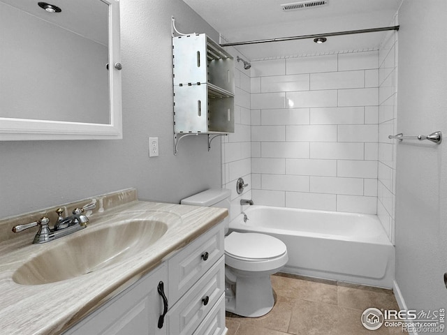 bathroom featuring tile patterned floors, shower / washtub combination, visible vents, toilet, and vanity