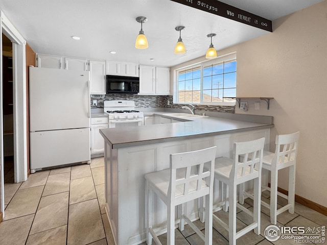 kitchen featuring white cabinetry, tasteful backsplash, a sink, and white appliances