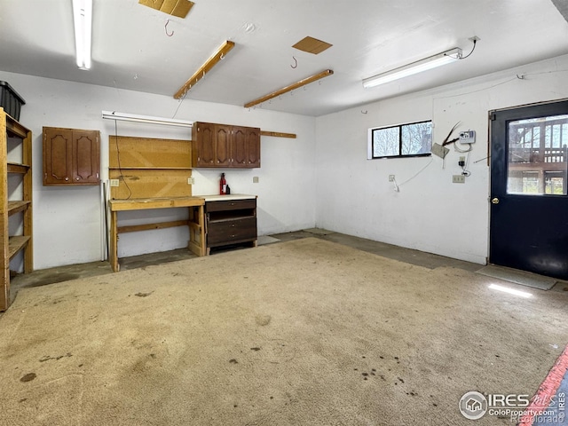 interior space featuring plenty of natural light and a workshop area
