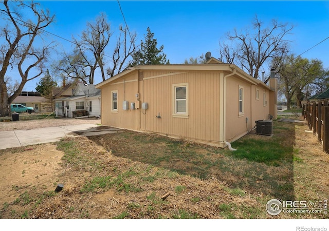 view of property exterior featuring a patio area and central AC