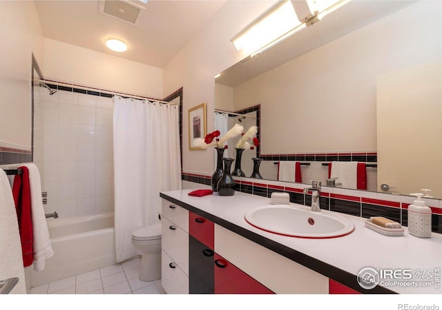 full bathroom featuring shower / tub combo, toilet, tile patterned flooring, and vanity