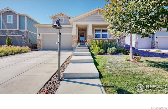 view of front of home with a garage and a front lawn