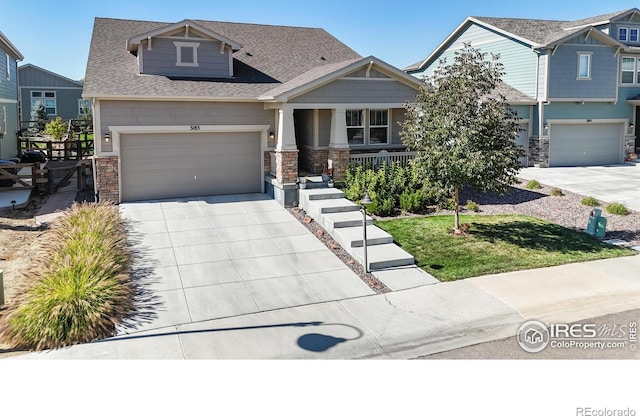 craftsman-style house with a garage and covered porch