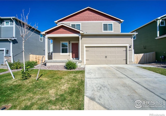 view of front of house with a front yard and a garage