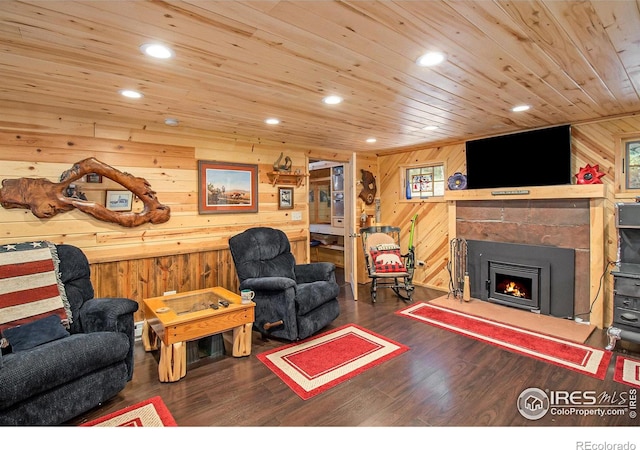 living room with wooden walls, dark hardwood / wood-style floors, and wooden ceiling