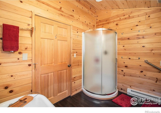 interior space with lofted ceiling, wooden walls, walk in shower, wood ceiling, and wood-type flooring