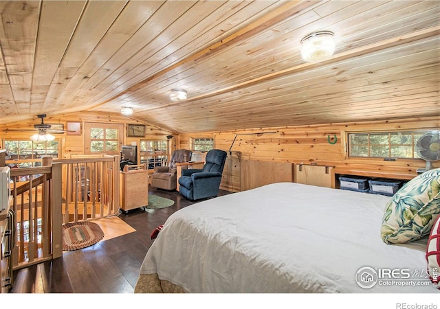 bedroom featuring lofted ceiling, wood walls, wood ceiling, and dark wood-type flooring