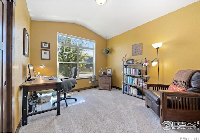 office area with light carpet and lofted ceiling