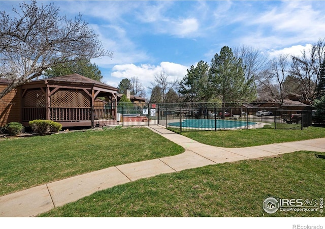 view of swimming pool featuring a gazebo and a lawn