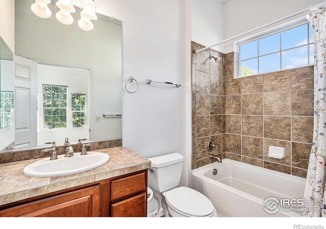 full bathroom featuring toilet, shower / bath combo, plenty of natural light, and vanity