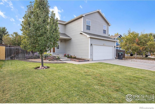 view of property with a garage and a front lawn