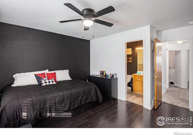 bedroom with connected bathroom, dark hardwood / wood-style flooring, and ceiling fan